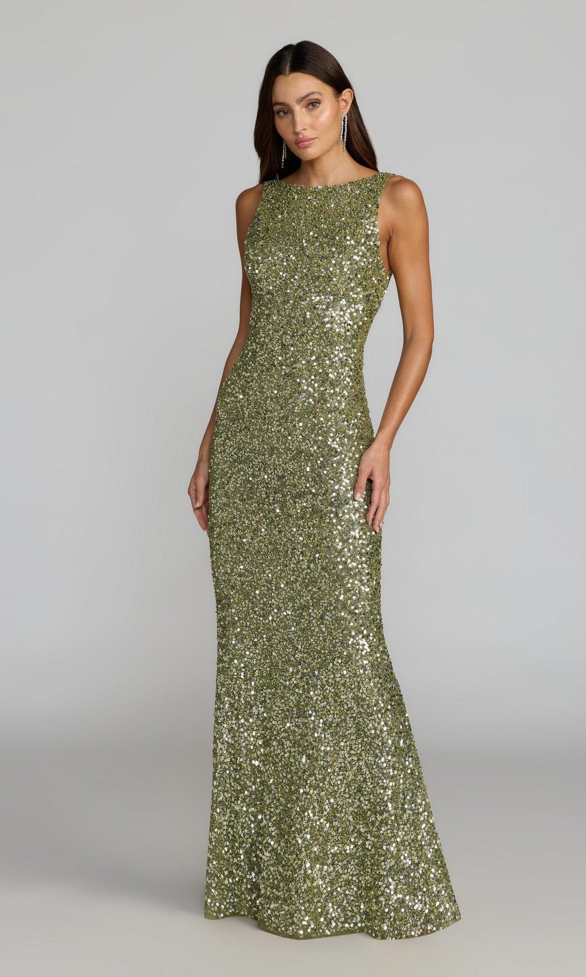 A woman wearing the Long Formal Dress: Mac Duggal 5185 in fitted, sleeveless, floor-length sage sequins stands against a plain gray background.
